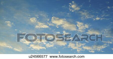 Stock Photo - Blue sky with clouds. Fotosearch