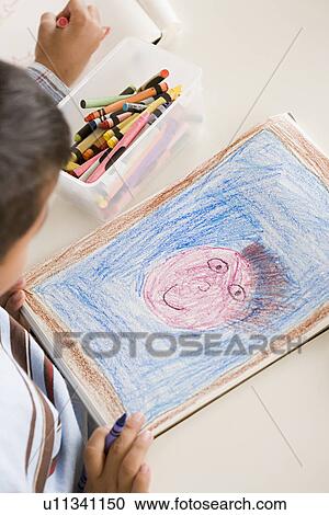 Boy (6-7) drawing in classroom View Large Photo Image Stock Image - Boy (6-7) drawing in classroom. Fotosearch