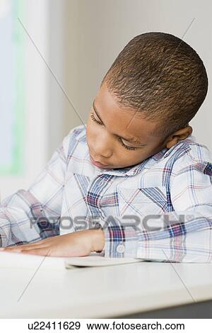 Boy (6-7) drawing View Large Photo Image Stock Photo - Boy (6-7) drawing. Fotosearch