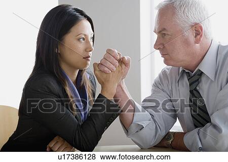 Business people arm wrestling View Large Photo Image Stock Photo - Business people arm wrestling. Fotosearch