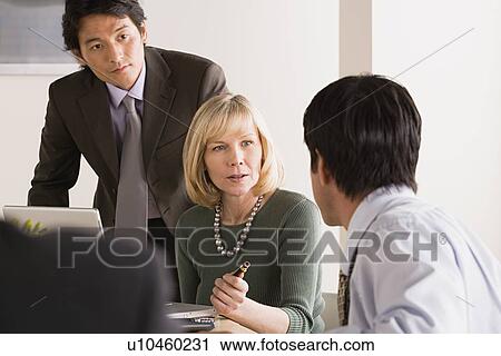 Business people at meeting View Large Photo Image Stock Image - Business people at meeting. Fotosearch