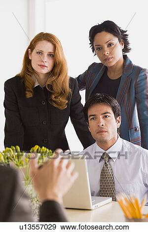Stock Photo - Business people at meeting. Fotosearch