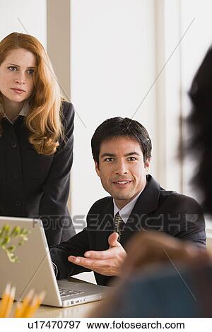 Stock Photo - Business people at meeting. Fotosearch