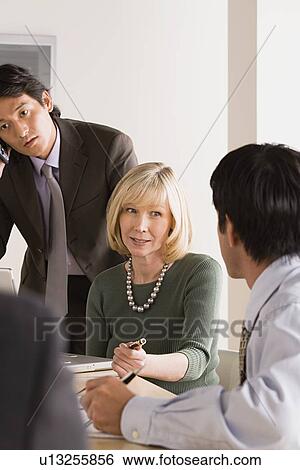 Business people at meeting View Large Photo Image Stock Photograph - Business people at meeting. Fotosearch