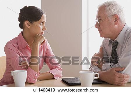 Business people talking in office View Large Photo Image Stock Photo - Business people talking in office. Fotosearch