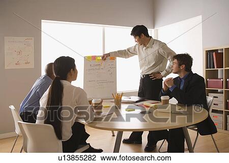 Business people working in office View Large Photo Image Stock Image - Business people working in office. Fotosearch