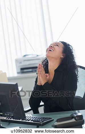 Business woman using computer and laughing View Large Photo Image Stock Image - Business woman using computer and laughing. Fotosearch