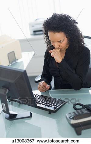 Stock Photo - Business woman using computer. Fotosearch