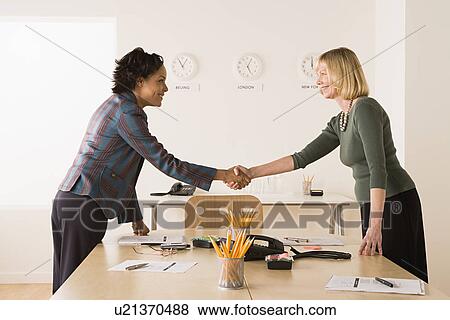 Business women shaking hands View Large Photo Image Stock Photo - Business women shaking hands. Fotosearch