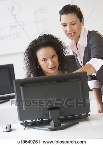 Business women using computer in office View Large Photo Image Stock Image - Business women using computer in office. Fotosearch
