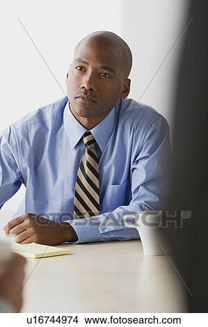 Picture - Businessman in office. Fotosearch