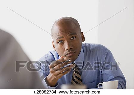 Businessman in office View Large Photo Image Picture - Businessman in office. Fotosearch