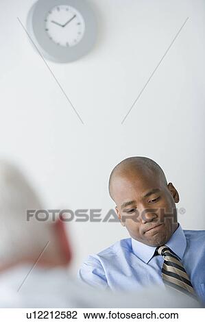 Businessman in office View Large Photo Image Stock Image - Businessman in office. Fotosearch