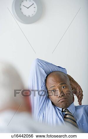 Businessman in office View Large Photo Image Stock Photograph - Businessman in office. Fotosearch