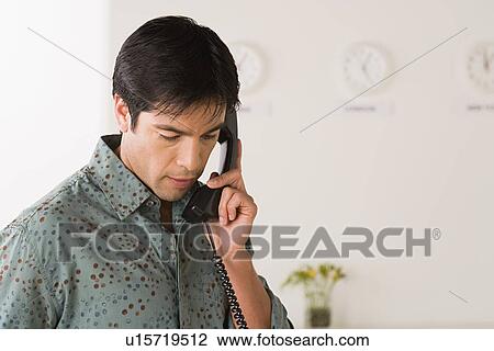 Businessman talking on phone View Large Photo Image Stock Image - Businessman talking on phone. Fotosearch