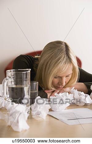 Businesswoman sleeping at desk with crumpled paper balls View Large Photo Image Stock Image - Businesswoman sleeping at desk with crumpled paper balls. Fotosearch