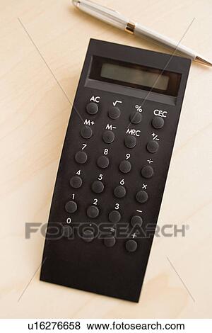 Stock Photo - Calculator on desk. Fotosearch
