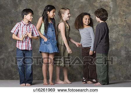 Children (6-7, 8-9) playing together, studio shot View Large Photo Image Stock Photo - Children (6-7, 8-9) playing together, studio shot. Fotosearch