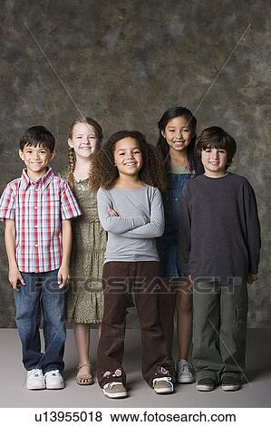 Children (6-7, 8-9) posing together, studio shot View Large Photo Image Stock Photo - Children (6-7, 8-9) posing together, studio shot. Fotosearch