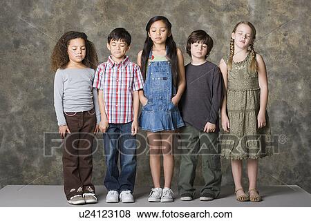 Children (6-7, 8-9) standing together with eyes closed, studio shot View Large Photo Image Stock Photo - Children (6-7, 8-9) standing together with eyes closed, studio shot. Fotosearch