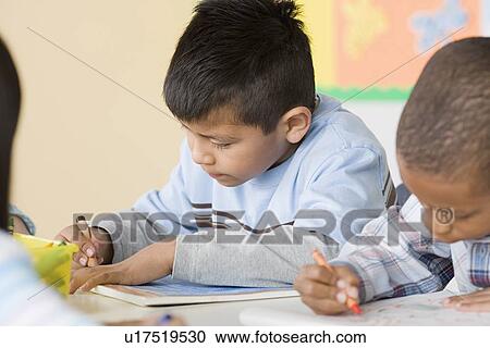 Children (6-7) drawing in classroom View Large Photo Image Stock Image - Children (6-7) drawing in classroom. Fotosearch