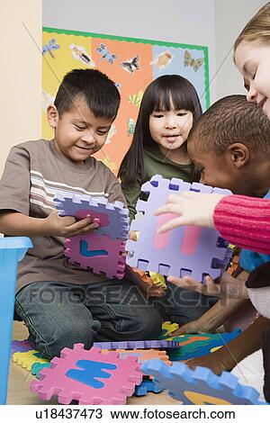 Children (6-7) learning in classroom View Large Photo Image Stock Image - Children (6-7) learning in classroom. Fotosearch
