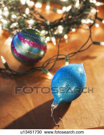 Stock Image - Christmas ornament under christmas tree. Fotosearch