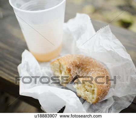 Stock Photo - Close up donut and apple cider. Fotosearch