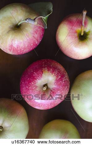 Stock Image - Close up of apples on table. Fotosearch