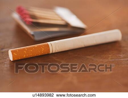 Close up of cigarette and matches View Large Photo Image Stock Image - Close up of cigarette and matches. Fotosearch
