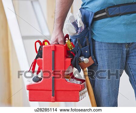 Close up of construction worker carrying tool box View Large Photo Image Picture - Close up of construction worker carrying tool box. Fotosearch