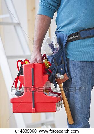 Close up of construction worker carrying tool box View Large Photo Image Stock Image - Close up of construction worker carrying tool box. Fotosearch