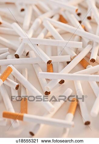Stock Image - Close up of heap of cigarettes. Fotosearch