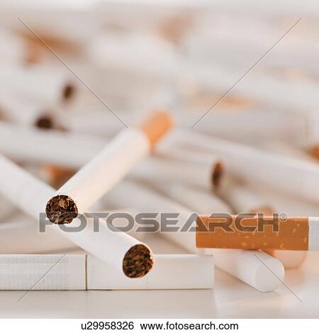 Close up of heap of cigarettes View Large Photo Image Stock Photograph - Close up of heap of cigarettes. Fotosearch