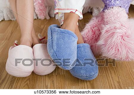 Close up of legs of three girls (10-11) wearing fluffy slippers View Large Photo Image Stock Photograph - Close up of legs of three girls (10-11) wearing fluffy slippers. Fotosearch