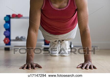 Close up of man doing push-ups View Large Photo Image Picture - Close up of man doing push-ups. Fotosearch