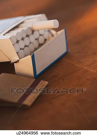 Close up of open cigarette pack and matches View Large Photo Image Stock Photograph - Close up of open cigarette pack and matches. Fotosearch