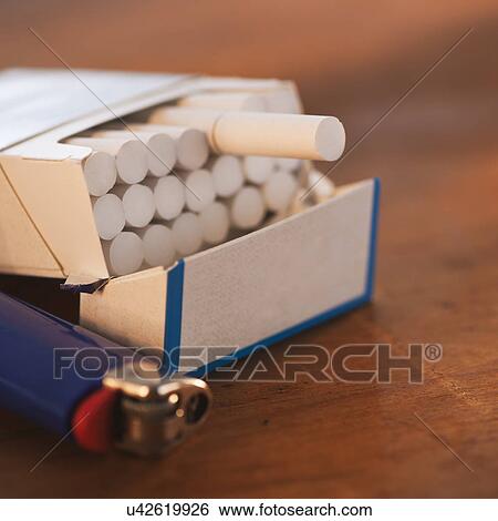 Close up of open cigarette pack and lighter View Large Photo Image Stock Photograph - Close up of open cigarette pack and lighter. Fotosearch