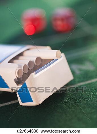 Close up of open cigarette pack on casino table View Large Photo Image Stock Image - Close up of open cigarette pack on casino table. Fotosearch