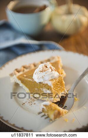 Close up of slice of pumpkin pie View Large Photo Image Stock Image - Close up of slice of pumpkin pie. Fotosearch