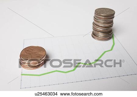Coins on sheet of paper with graph View Large Photo Image Picture - Coins on sheet of paper with graph. Fotosearch