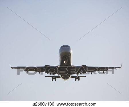 Commercial aeroplane taking off from runway View Large Photo Image Stock Photograph - Commercial aeroplane taking off from runway. Fotosearch
