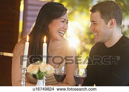 Couple enjoying fine meal in restaurant View Large Photo Image Picture - Couple enjoying fine meal in restaurant. Fotosearch