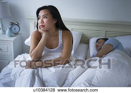 Stock Photo - Couple in bed. Fotosearch