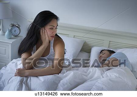 Couple in bed View Large Photo Image Stock Photograph - Couple in bed. Fotosearch