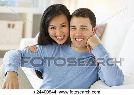 Picture - Couple relaxing at home. Fotosearch