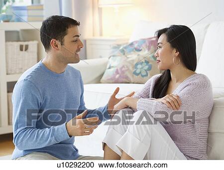 Stock Image - Couple relaxing at home. Fotosearch