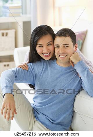 Stock Photography - Couple relaxing at home. Fotosearch