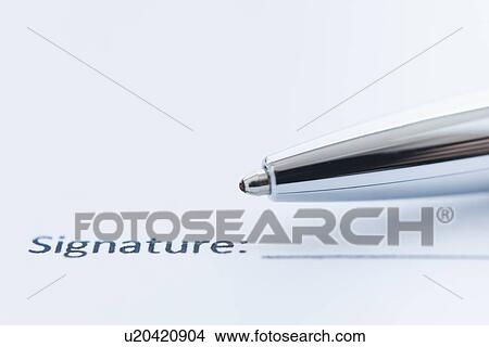 Picture - Detail of document with ballpoint pen, studio shot. Fotosearch