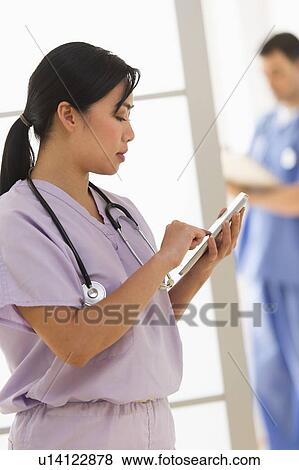 Doctor and nurse in hospital View Large Photo Image Stock Photo - Doctor and nurse in hospital. Fotosearch